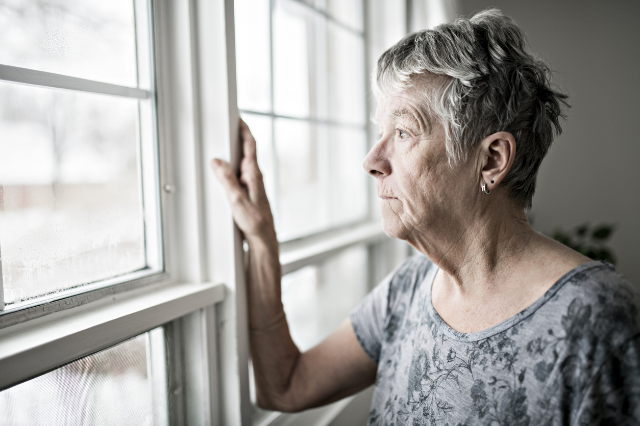 A sad lonely 70 years old senior in is apartment